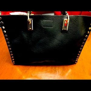 Black purse with red interior